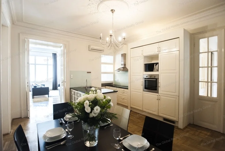 In Budapest, in the 5th district with good public transportation options a 133qm 2nd floor apartment is available for rent in a condominium. There is