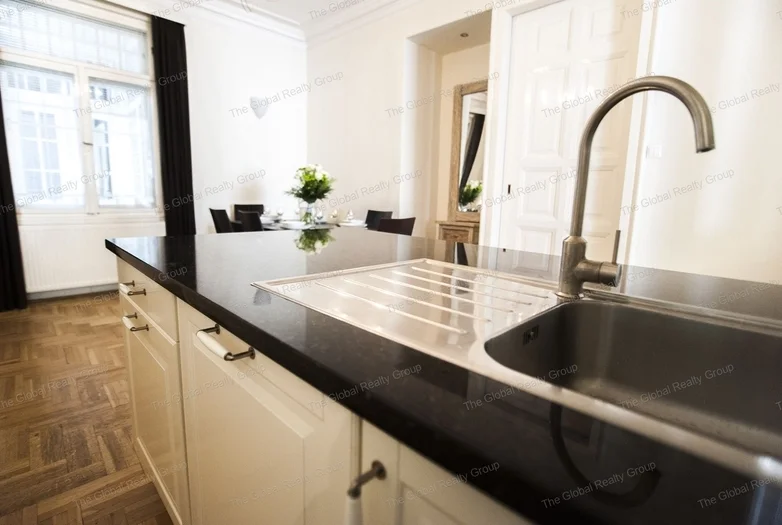 In Budapest, in the 5th district with good public transportation options a 133qm 2nd floor apartment is available for rent in a condominium. There is